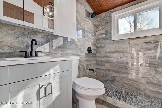 2161 Bushkill Cir, Bushkill, PA 18324 - full bathroom featuring tiled shower, wood ceiling, vanity, toilet, and tasteful backsplash