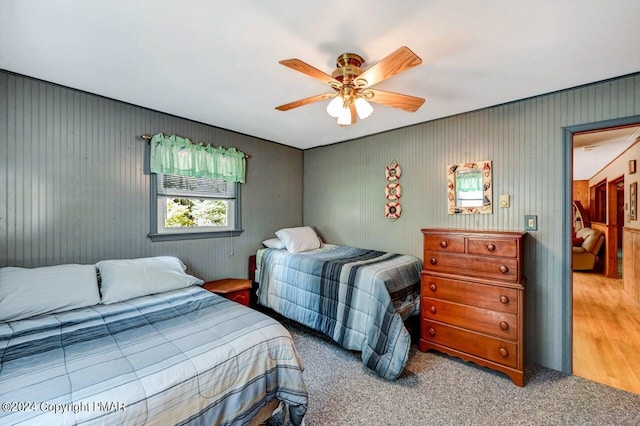 bedroom with ceiling fan and carpet flooring