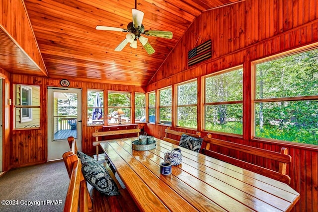 sunroom with vaulted ceiling, wooden ceiling, and a ceiling fan