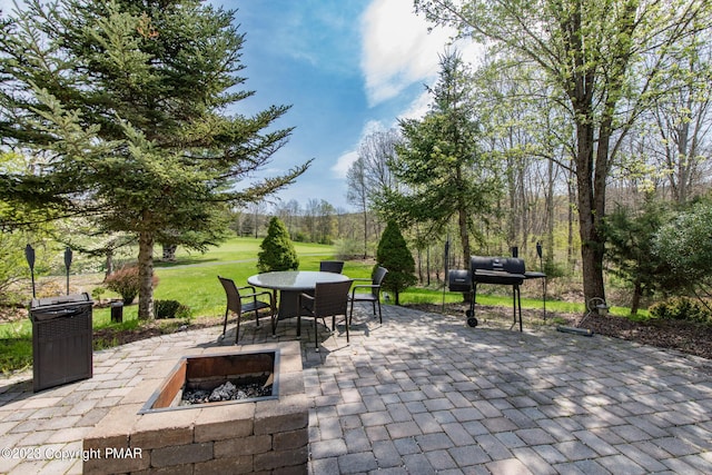 view of patio / terrace featuring an outdoor fire pit and area for grilling