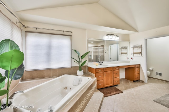 bathroom featuring visible vents, toilet, vaulted ceiling, vanity, and a shower stall