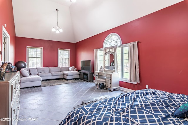 bedroom featuring high vaulted ceiling, tile patterned flooring, and an inviting chandelier