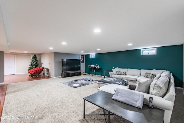 living room featuring recessed lighting, baseboards, and wood finished floors