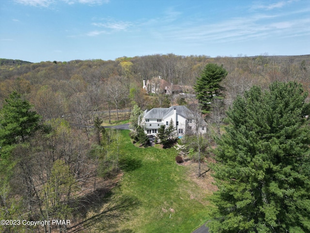 bird's eye view featuring a view of trees