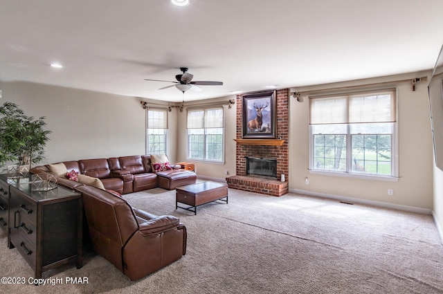 living area with carpet, recessed lighting, a brick fireplace, ceiling fan, and baseboards