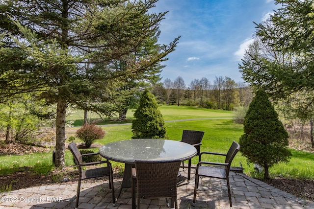 view of patio featuring outdoor dining area