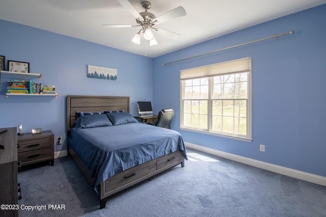 bedroom with a ceiling fan, carpet flooring, and baseboards