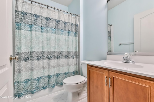 full bathroom featuring tile patterned flooring, vanity, and toilet