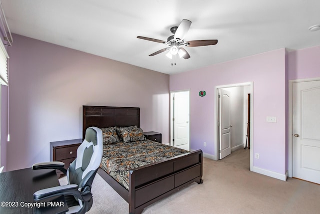 bedroom with light carpet, ceiling fan, and baseboards