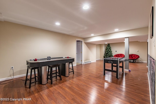 game room featuring baseboards, baseboard heating, wood finished floors, and recessed lighting