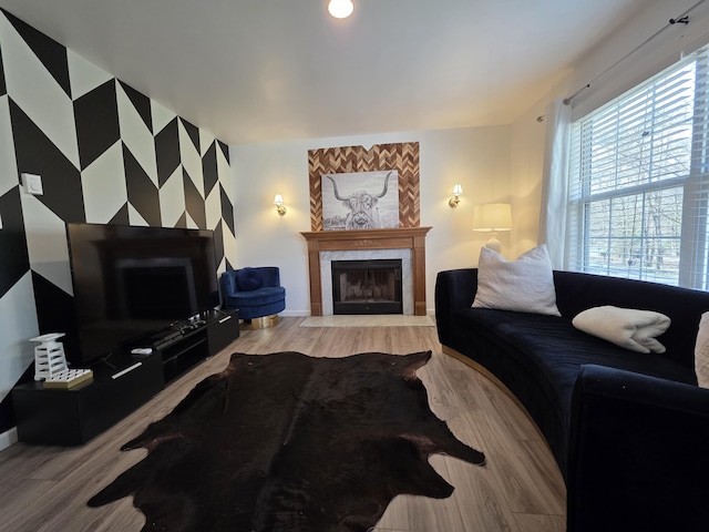 1490 Waterfront Dr, Tobyhanna, PA 18466 - living area with a tiled fireplace, light wood-style floors, and baseboards