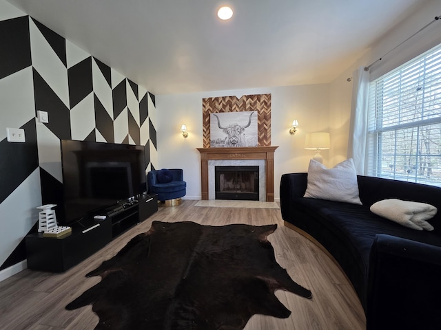 1490 Waterfront Dr, Tobyhanna, PA 18466 - living room featuring a tiled fireplace, light wood-type flooring, and baseboards