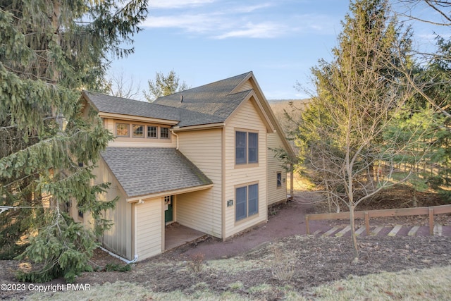 view of front of property featuring roof with shingles