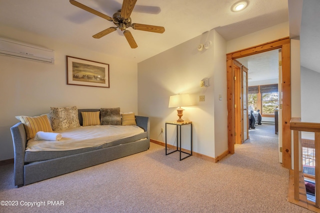 living room with a ceiling fan, an AC wall unit, baseboards, and carpet flooring