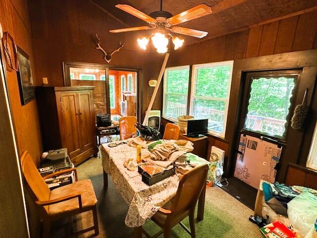 326 Somerset Dr, East Stroudsburg, PA 18301 - home office featuring light colored carpet, a ceiling fan, and wood walls