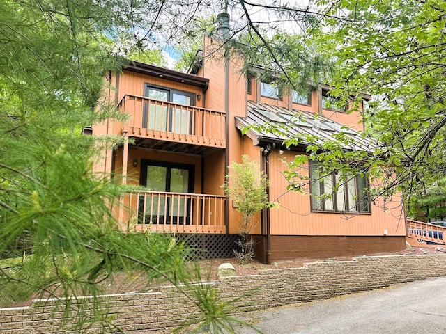 326 Somerset Dr, East Stroudsburg, PA 18301 - view of front of home with a balcony and a chimney
