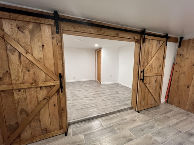 1553 Locust Ln, Pocono Lake, PA 18347 - basement featuring a barn door and baseboards