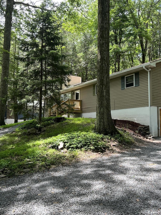 1553 Locust Ln, Pocono Lake, PA 18347 - view of side of home featuring a deck