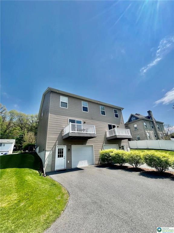 630 Lehigh Gap St, Walnutport, PA 18088 - view of front of property with driveway, a garage, and a balcony