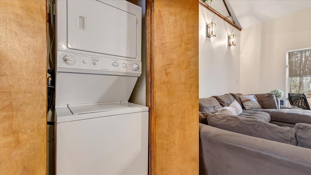 laundry room featuring laundry area and stacked washer and clothes dryer