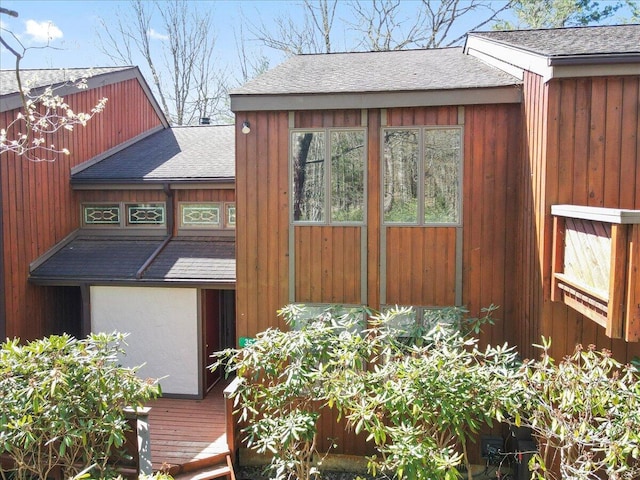 exterior space with a shingled roof