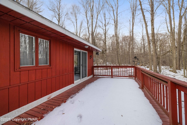 view of snow covered deck