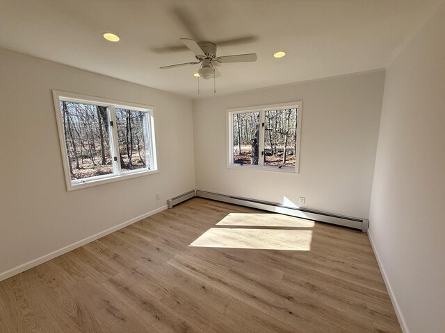 248 Seneca Dr, Milford, PA 18337 - spare room featuring plenty of natural light, a baseboard radiator, ceiling fan, light wood finished floors, and recessed lighting