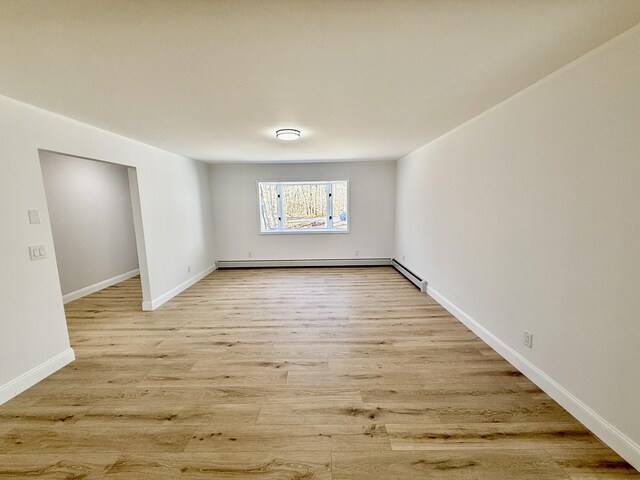 248 Seneca Dr, Milford, PA 18337 - spare room with light wood-style flooring and baseboard heating