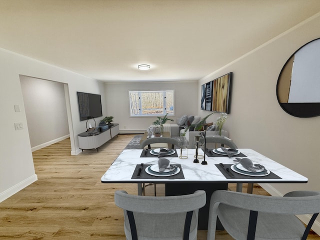 248 Seneca Dr, Milford, PA 18337 - dining room featuring light wood finished floors and a baseboard heating unit