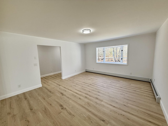 248 Seneca Dr, Milford, PA 18337 - spare room featuring a baseboard radiator, a baseboard heating unit, and light wood finished floors