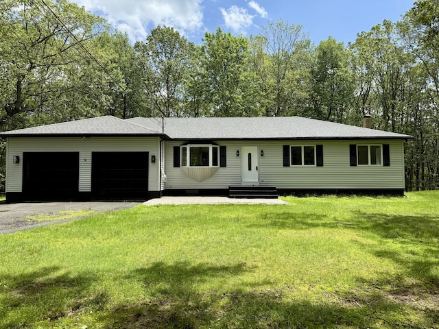 248 Seneca Dr, Milford, PA 18337 - view of front of property with an attached garage, a front lawn, driveway, a chimney, and roof with shingles