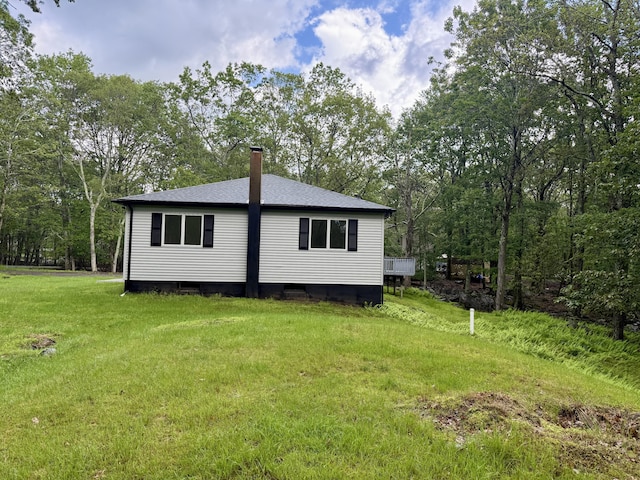 248 Seneca Dr, Milford, PA 18337 - view of property exterior featuring a chimney, a lawn, and a shingled roof
