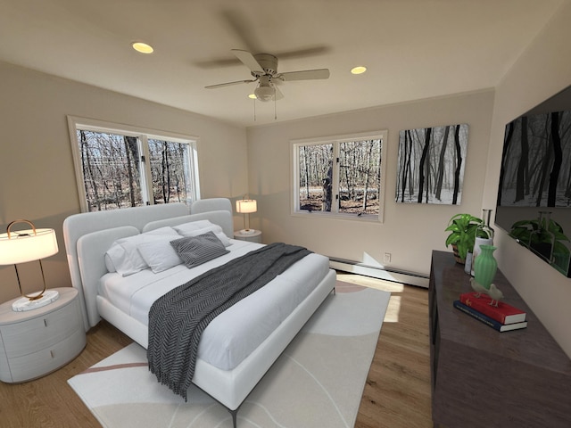 248 Seneca Dr, Milford, PA 18337 - bedroom featuring baseboard heating, wood finished floors, recessed lighting, and a ceiling fan