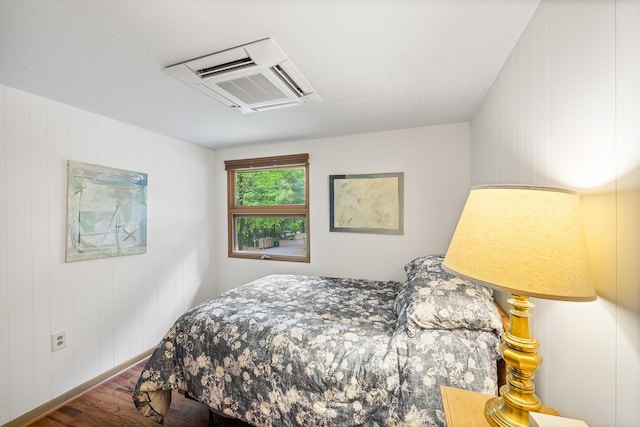 104 Jimmy Pond Ct, Pocono Pines, PA 18350 - bedroom featuring wood finished floors and wooden walls