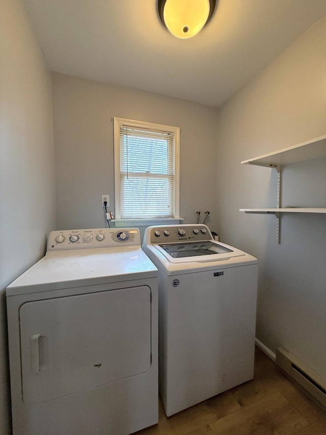 104 Sunset Dr, Mount Pocono, PA 18344 - clothes washing area featuring wood finished floors, washer and clothes dryer, a baseboard heating unit, baseboards, and laundry area