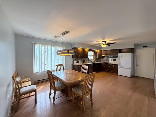 104 Sunset Dr, Mount Pocono, PA 18344 - dining space featuring plenty of natural light, visible vents, a ceiling fan, and wood finished floors