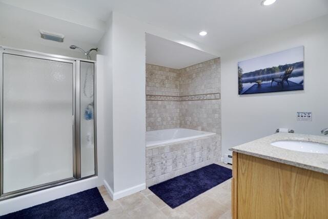 232 Stafford Dr, Bushkill, PA 18324 - bathroom with an enclosed shower, recessed lighting, tile patterned floors, tiled bath, and vanity
