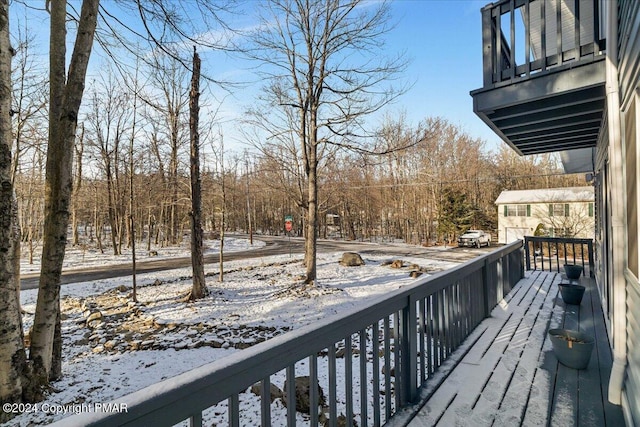 view of snow covered deck