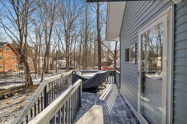 view of snow covered deck