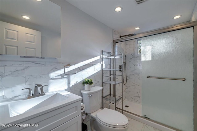 bathroom with marble finish floor, recessed lighting, toilet, a shower stall, and vanity