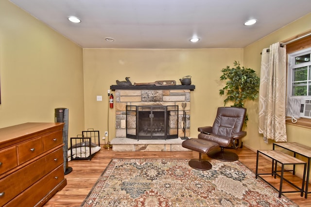 1046 Maple Dr, Pocono Lake, PA 18347 - living area featuring wood finished floors, a fireplace, and recessed lighting