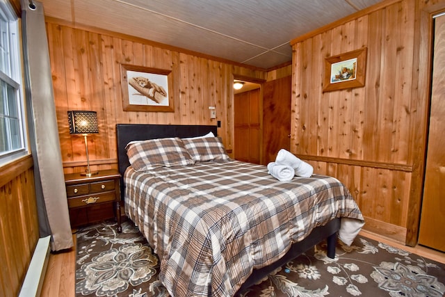 1046 Maple Dr, Pocono Lake, PA 18347 - bedroom with wood walls and wood finished floors