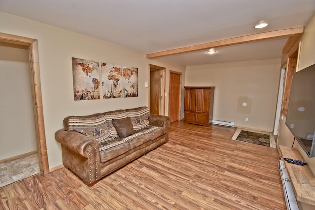 1046 Maple Dr, Pocono Lake, PA 18347 - living area with a baseboard heating unit and light wood-type flooring