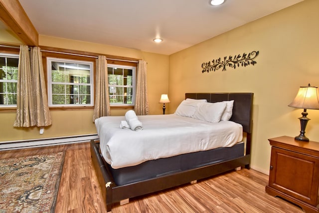 1046 Maple Dr, Pocono Lake, PA 18347 - bedroom with wood finished floors, baseboard heating, and recessed lighting