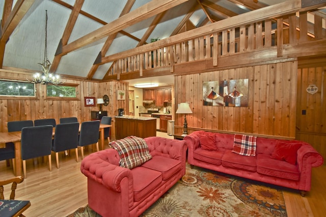 1046 Maple Dr, Pocono Lake, PA 18347 - living room with wood walls, a chandelier, light wood-type flooring, high vaulted ceiling, and beam ceiling