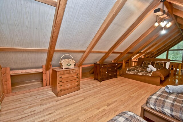 1046 Maple Dr, Pocono Lake, PA 18347 - bedroom with vaulted ceiling and wood finished floors