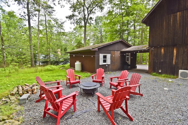 1046 Maple Dr, Pocono Lake, PA 18347 - view of patio / terrace with an outdoor fire pit