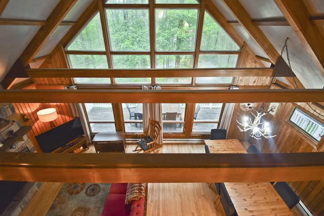 1046 Maple Dr, Pocono Lake, PA 18347 - living room featuring wood finished floors, high vaulted ceiling, and a chandelier