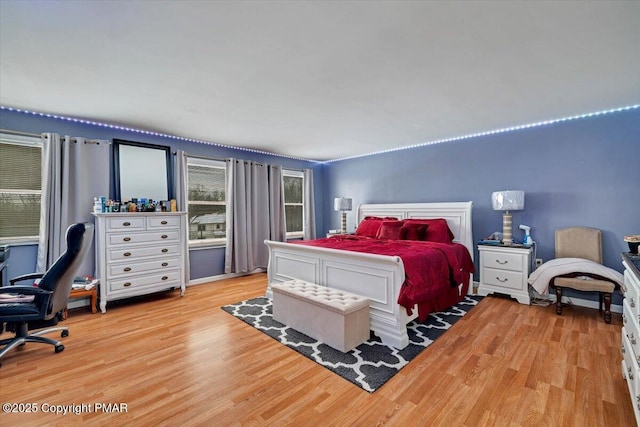 bedroom featuring light wood-type flooring