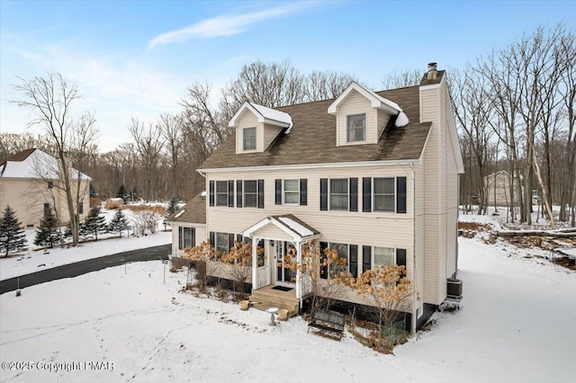 view of front of home featuring a chimney